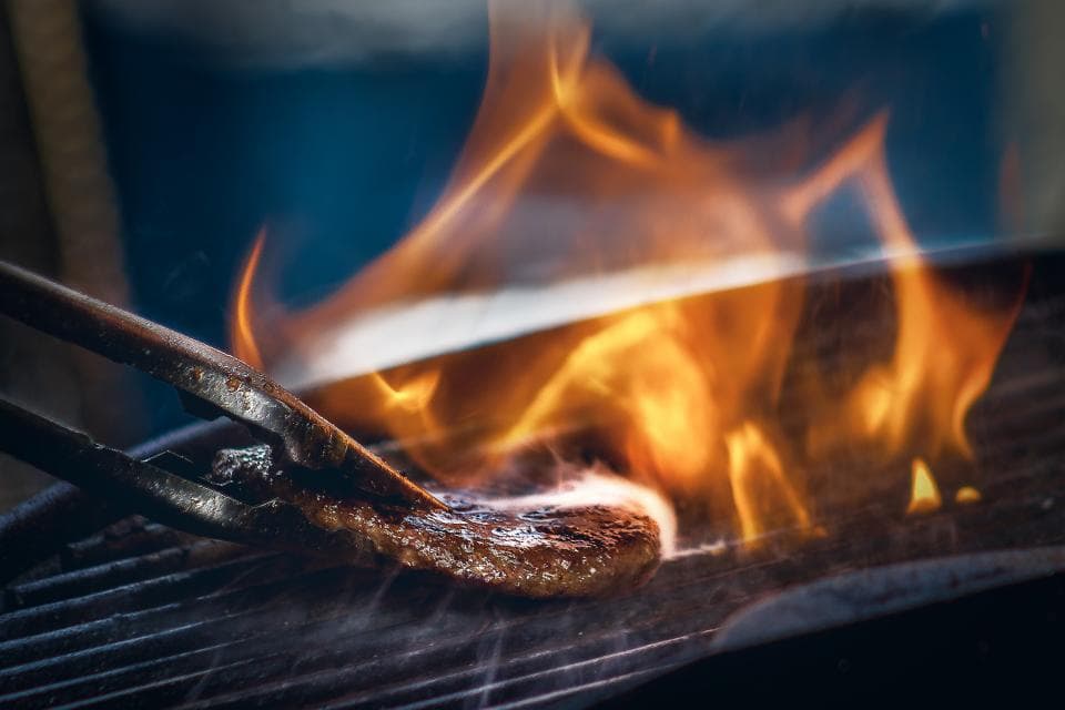 Flames rising from the grill